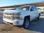 2018 Chevrolet Silverado 1500 High Country with VIN 3GCUKTEJ9JG131133, listed as a IAAI auction lot 41389559 with 221,788 mi miles and . Bid and sale history available at DreamBid. Image 2.