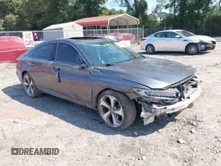 2018 Honda Accord Touring with VIN 1HGCV2F91JA036860, listed as a IAAI auction lot 43212863 with 166,193 mi miles and . Bid and sale history available at DreamBid. Image 1.