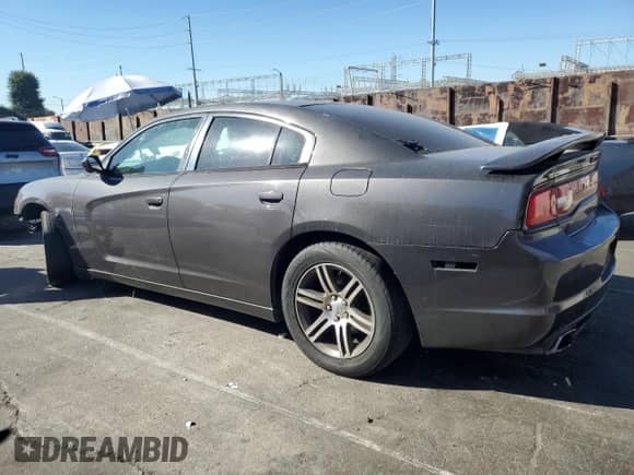 2014 Dodge Charger Road/Track with VIN 2C3CDXCT0EH330258, listed as a Copart auction lot 90421655 with 114,910 mi miles and Clean title. Bid and sale history available at DreamBid. Image 2.
