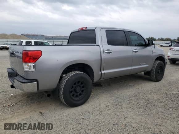 2012 Toyota Tundra Limited with VIN 5TFHY5F13CX241054, listed as a Copart auction lot 90242605 with 122,532 mi miles and Salvage title. Bid and sale history available at DreamBid. Image 3.