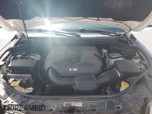 2014 Jeep Grand Cherokee Laredo with VIN 1C4RJEAGXEC157778, listed as a Copart auction lot 65999535 with 124,804 mi miles and Salvage title. Bid and sale history available at DreamBid. Image 12.