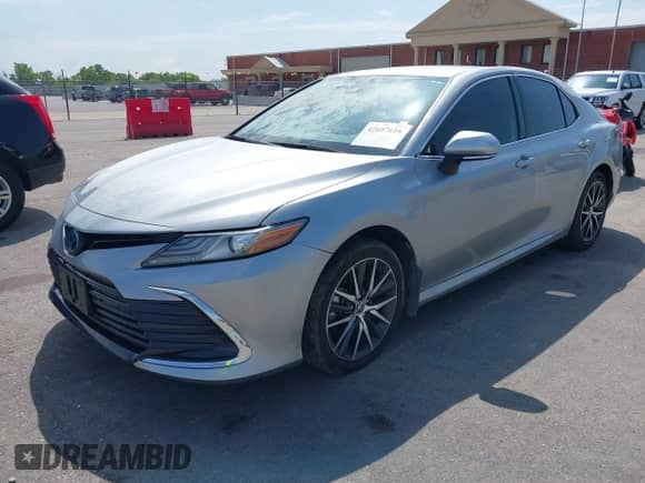 2021 Toyota Camry Hybrid XLE with VIN 4T1F31AK5MU565376, listed as a IAAI auction lot 42687616 with 57,880 mi miles and . Bid and sale history available at DreamBid. Image 2.