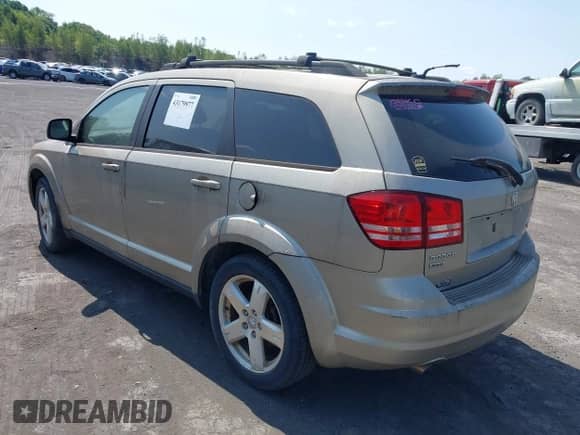 2009 Dodge Journey SXT z VIN 3D4GH57V59T583240, wystawiony jako IAAI lot #43179977 z przebiegiem 151 070 mil mil oraz . Historia ofert i sprzedaży dostępna na DreamBid. Obrazek 3.