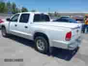 2003 Dodge Dakota SLT with VIN 1D7HL48N03S184534, listed as a IAAI auction lot 42423520 with 197,070 mi miles and . Bid and sale history available at DreamBid. Image 3.