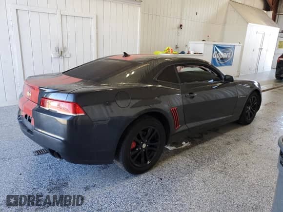 2015 Chevrolet Camaro LS с VIN 2G1FB1E3XF9311102, выставлен на аукционе Copart как лот 82121825 с пробегом 135 559 миль миль и Списание • Salvage title. История ставок и продаж доступна на DreamBid. Изображение 3.