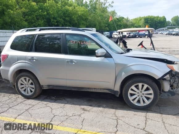 2012 Subaru Forester X Premium z VIN JF2SHADCXCG404478, wystawiony jako IAAI lot #42346705 z przebiegiem 185 665 mil mil oraz . Historia ofert i sprzedaży dostępna na DreamBid. Obrazek 13.