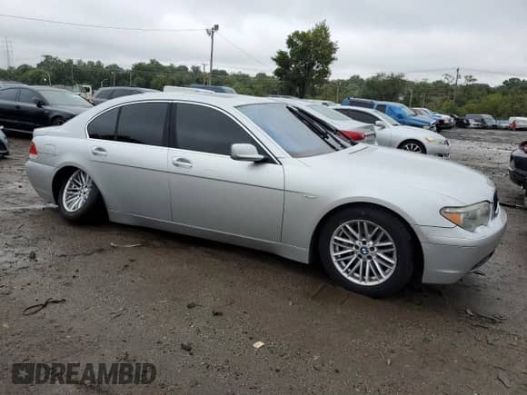 2004 BMW 7 Series 745i with VIN WBAGL634X4DP70421, listed as a Copart auction lot 73309744 with 123,457 mi miles and Salvage title. Bid and sale history available at DreamBid. Image 4.