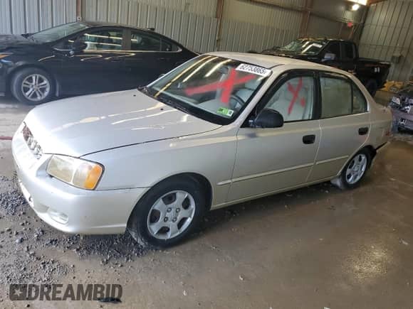 2002 Hyundai Accent GL z VIN KMHCG45C32U373009, wystawiony jako Copart lot #62753865 z przebiegiem Nie podano mil oraz Szkoda całkowita • Salvage title. Historia ofert i sprzedaży dostępna na DreamBid. Obrazek 1.
