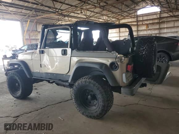 2004 Jeep Wrangler Sport z VIN 1J4FA49S14P768676, wystawiony jako Copart lot #69976745 z przebiegiem 165 894 mil mil oraz Szkoda całkowita • Salvage title. Historia ofert i sprzedaży dostępna na DreamBid. Obrazek 2.