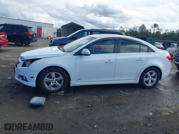 2014 Chevrolet Cruze 1LT z VIN 1G1PC5SB8E7297057, wystawiony jako IAAI lot #43383534 z przebiegiem 196 127 mil mil oraz . Historia ofert i sprzedaży dostępna na DreamBid. Obrazek 14.