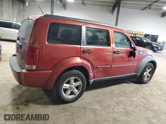 2009 Dodge Nitro SE z VIN 1D8GT28K09W505829, wystawiony jako Copart lot #52595205 z przebiegiem 316 534 mil mil oraz Szkoda całkowita • Salvage title. Historia ofert i sprzedaży dostępna na DreamBid. Obrazek 3.