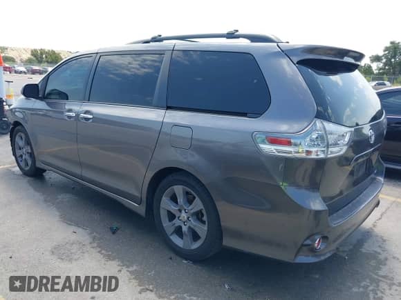 2014 Toyota Sienna SE with VIN 5TDXK3DC7ES487541, listed as a IAAI auction lot 42998929 with 214,475 mi miles and . Bid and sale history available at DreamBid. Image 3.