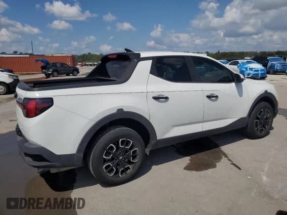 2022 Hyundai Santa Cruz SEL с VIN 5NTJB4AE1NH009303, выставлен на аукционе Copart как лот 69739335 с пробегом 48 774 миль миль и На запчасти • Non repairable. История ставок и продаж доступна на DreamBid. Изображение 3.