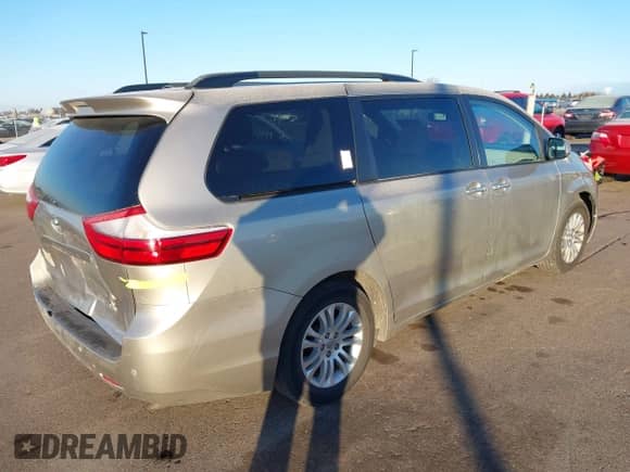 2016 Toyota Sienna XLE with VIN 5TDYK3DC8GS713481, listed as a IAAI auction lot 41239824 with 176,935 mi miles and . Bid and sale history available at DreamBid. Image 4.