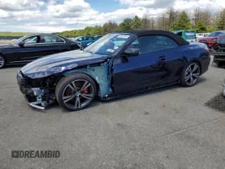 2024 BMW 4 Series 430i xDrive with VIN WBA43AT06RCP04562, listed as a Copart auction lot 57323704 with 737 mi miles and Salvage title. Bid and sale history available at DreamBid. Image 1.