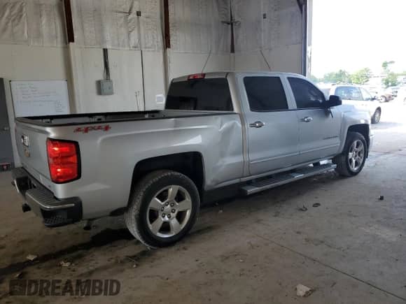 2015 Chevrolet Silverado 1500 LT with VIN 1GCUKREC3FF198520, listed as a Copart auction lot 59369405 with 154,502 mi miles and Salvage title. Bid and sale history available at DreamBid. Image 3.