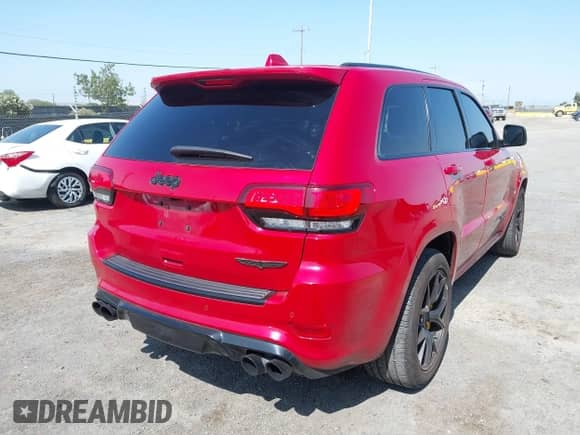 2018 Jeep Grand Cherokee Trackhawk z VIN 1C4RJFN95JC309851, wystawiony jako IAAI lot #42437320 z przebiegiem 56 504 mil mil oraz . Historia ofert i sprzedaży dostępna na DreamBid. Obrazek 4.