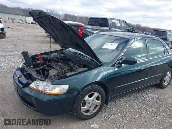 2000 Honda Accord EX with VIN JHMCG5659YC001925, listed as a IAAI auction lot 41715654 with 190,605 mi miles and . Bid and sale history available at DreamBid. Image 6.