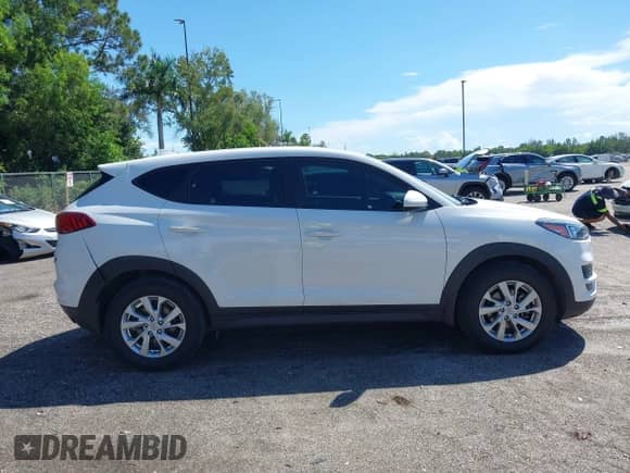2021 Hyundai Tucson SE with VIN KM8J23A41MU318897, listed as a IAAI auction lot 43233832 with 112,924 mi miles and . Bid and sale history available at DreamBid. Image 12.