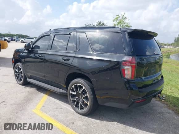 2023 Chevrolet Tahoe RST with VIN 1GNSCRKD2PR107150, listed as a IAAI auction lot 39049156 with 40,956 mi miles and . Bid and sale history available at DreamBid. Image 3.