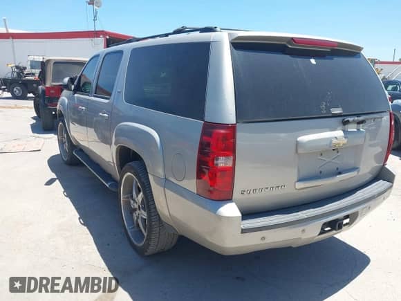 2009 Chevrolet Suburban 1LT z VIN 1GNFC26J89R169907, wystawiony jako IAAI lot #42817134 z przebiegiem 194 554 mil mil oraz . Historia ofert i sprzedaży dostępna na DreamBid. Obrazek 3.