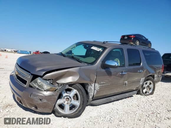 2014 Chevrolet Suburban LT with VIN 1GNSCJE05ER175420, listed as a Copart auction lot 91117505 with 165,340 mi miles and Salvage title. Bid and sale history available at DreamBid. Image 1.