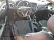 2012 Hyundai Veloster w/Black Int z VIN KMHTC6AD9CU082716, wystawiony jako Copart lot #68193135 z przebiegiem 163 114 mil mil oraz Szkoda całkowita • Salvage title. Historia ofert i sprzedaży dostępna na DreamBid. Obrazek 8.