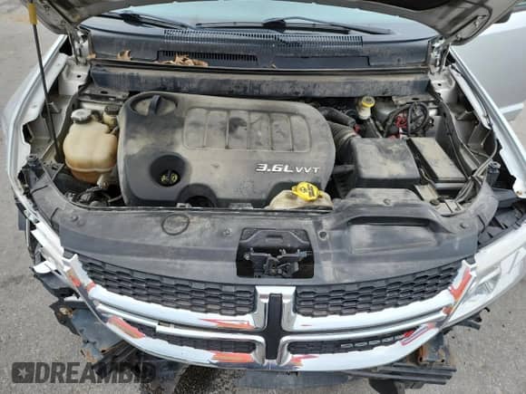 2014 Dodge Journey SE with VIN 3C4PDDAG0ET284651, listed as a Copart auction lot 64187145 with 182,485 mi miles and Salvage title. Bid and sale history available at DreamBid. Image 12.