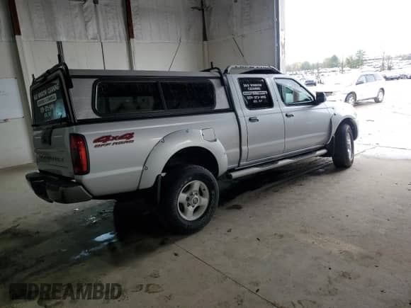 2002 Nissan Frontier XE with VIN 1N6ED29Y72C308392, listed as a Copart auction lot 50306985 with 210,235 mi miles and Salvage title. Bid and sale history available at DreamBid. Image 3.