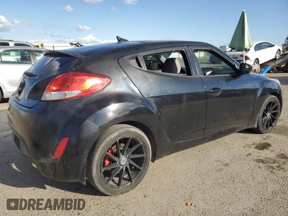 2013 Hyundai Veloster w/Black Int z VIN KMHTC6AD8DU147119, wystawiony jako Copart lot #82261415 z przebiegiem 132 516 mil mil oraz Szkoda całkowita • Salvage title. Historia ofert i sprzedaży dostępna na DreamBid. Obrazek 3.