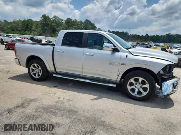 2014 Ram 1500 Laramie with VIN 1C6RR6NT0ES397960, listed as a Copart auction lot 61458895 with 148,298 mi miles and Salvage title. Bid and sale history available at DreamBid. Image 4.