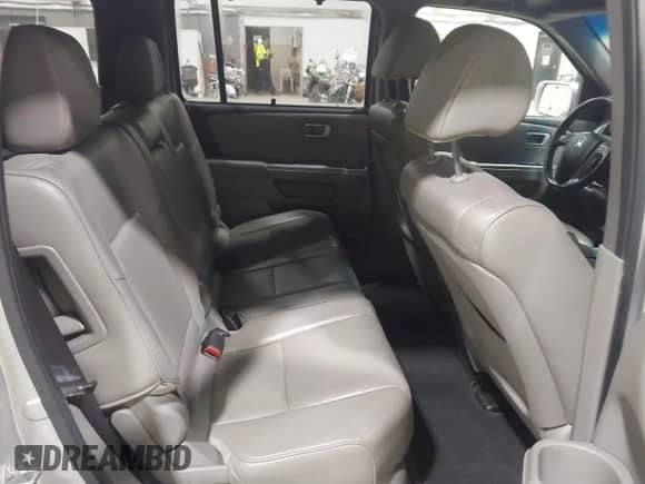 2012 Honda Pilot Touring with VIN 5FNYF4H90CB034523, listed as a IAAI auction lot 43540902 with 269,702 mi miles and . Bid and sale history available at DreamBid. Image 8.