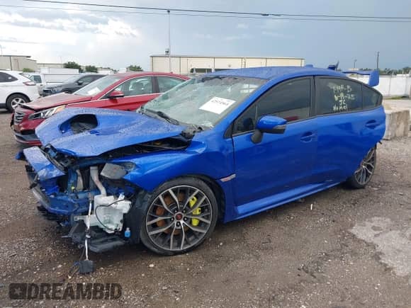2020 Subaru WRX STI with VIN JF1VA2E67L9831559, listed as a IAAI auction lot 42574564 with 67,333 mi miles and . Bid and sale history available at DreamBid. Image 2.
