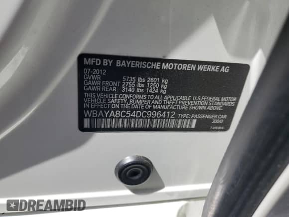 2013 BMW 7 Series 750i with VIN WBAYA8C54DC996412, listed as a Copart auction lot 56982895 with 124,258 mi miles and Salvage title. Bid and sale history available at DreamBid. Image 12.