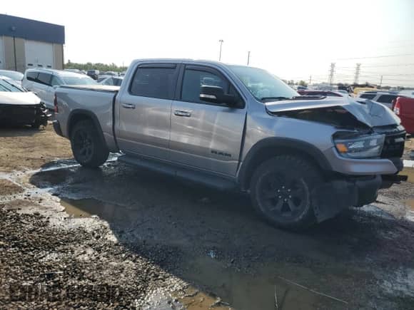 2022 Ram 1500 Rebel z VIN 1C6SRFLM8NN308373, wystawiony jako Copart lot #66814305 z przebiegiem 66 857 mil mil oraz Czysty tytuł • Clean title. Historia ofert i sprzedaży dostępna na DreamBid. Obrazek 4.