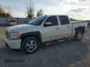 2013 Chevrolet Silverado 1500 LTZ with VIN 3GCPKTE71DG310966, listed as a Copart auction lot 82216535 with 153,969 mi miles and Clean title. Bid and sale history available at DreamBid. Image 1.