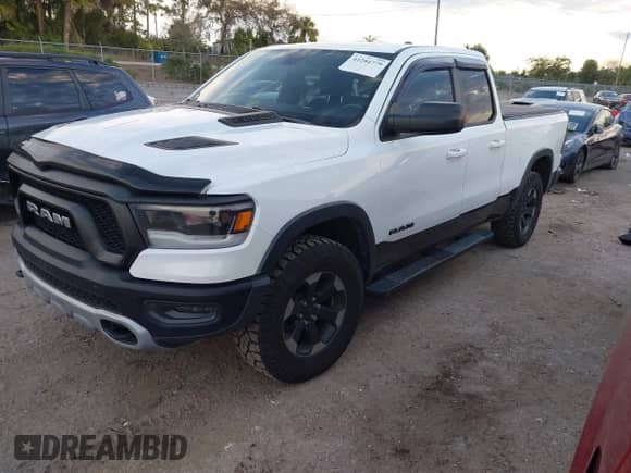 2019 Ram 1500 Rebel with VIN 1C6SRFET2KN860824, listed as a IAAI auction lot 41284779 with 105,715 mi miles and . Bid and sale history available at DreamBid. Image 17.
