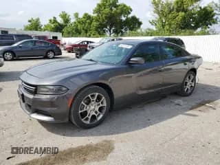 2015 Dodge Charger SE with VIN 2C3CDXFG1FH718048, listed as a Copart auction lot 65519185 with 129,379 mi miles and Salvage title. Bid and sale history available at DreamBid. Image 1.