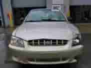 2002 Hyundai Accent GL z VIN KMHCG45C12U355561, wystawiony jako Copart lot #54546945 z przebiegiem 22 893 mil mil oraz Szkoda całkowita • Salvage title. Historia ofert i sprzedaży dostępna na DreamBid. Obrazek 5.