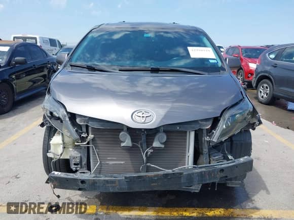 2014 Toyota Sienna SE with VIN 5TDXK3DC7ES487541, listed as a IAAI auction lot 42998929 with 214,475 mi miles and . Bid and sale history available at DreamBid. Image 6.