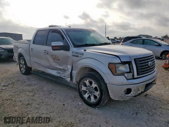 2012 Ford F-150 FX2 with VIN 1FTFW1CF1CFB34595, listed as a Copart auction lot 87390045 with 303,572 mi miles and Salvage title. Bid and sale history available at DreamBid. Image 4.