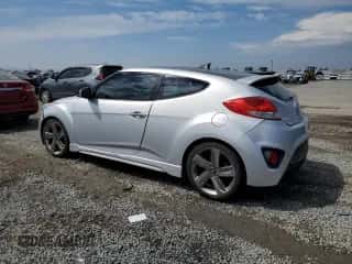2013 Hyundai Veloster Turbo z VIN KMHTC6AE7DU173199, wystawiony jako Copart lot #81507235 z przebiegiem 134 071 mil mil oraz Szkoda całkowita • Salvage title. Historia ofert i sprzedaży dostępna na DreamBid. Obrazek 2.