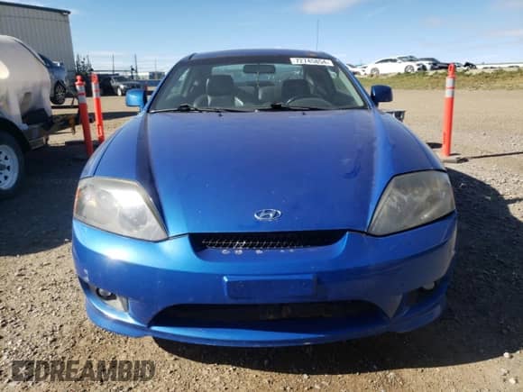 2006 Hyundai Tiburon SE с VIN KMHHN65D06U230928, выставлен на аукционе Copart как лот 72745854 с пробегом 246 837 миль миль и Чистый • Clean title. История ставок и продаж доступна на DreamBid. Изображение 5.