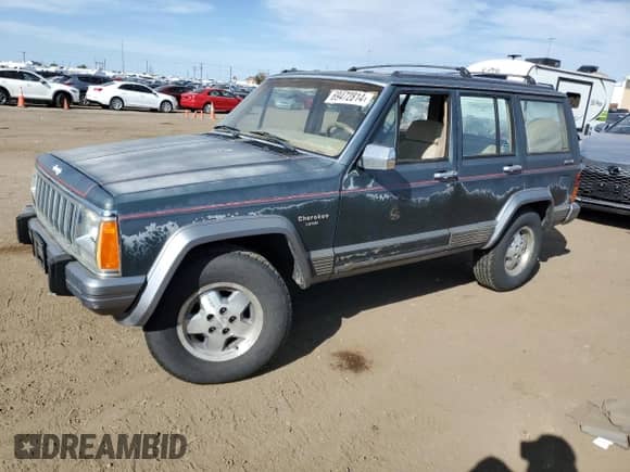 1991 Jeep Grand Cherokee with VIN 1J4FJ58S4ML592642, listed as a Copart auction lot 69472814 with 153,328 mi miles and Clean title. Bid and sale history available at DreamBid. Image 1.
