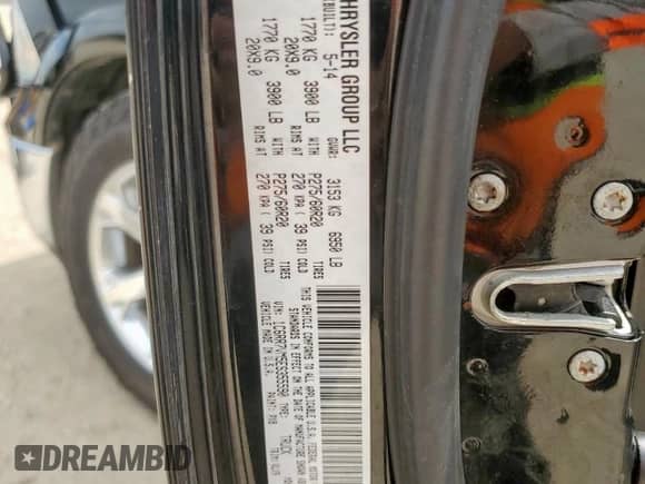 2014 Ram 1500 Laramie z VIN 1C6RR7VM5ES355590, wystawiony jako Copart lot #81877765 z przebiegiem 105 567 mil mil oraz Czysty tytuł • Clean title. Historia ofert i sprzedaży dostępna na DreamBid. Obrazek 12.