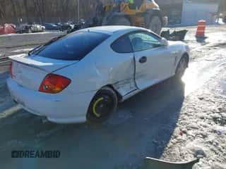 2004 Hyundai Tiburon GS с VIN KMHHM65D94U105300, выставлен на аукционе IAAI как лот 41342124 с пробегом 229 938 миль миль и . История ставок и продаж доступна на DreamBid. Изображение 4.