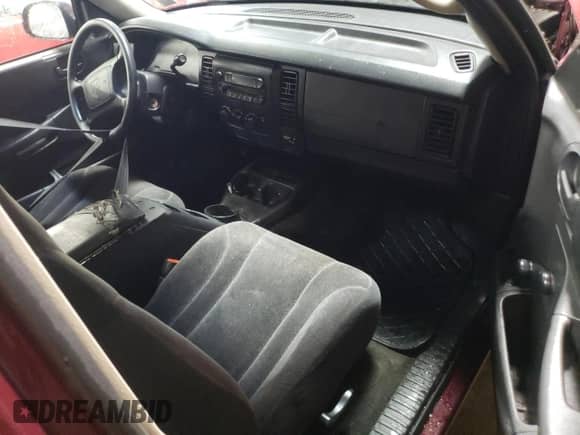 2003 Dodge Dakota z VIN 1D7FL16X23S110090, wystawiony jako Copart lot #42705065 z przebiegiem Nie podano mil oraz Nie do naprawy • Non repairable. Historia ofert i sprzedaży dostępna na DreamBid. Obrazek 8.