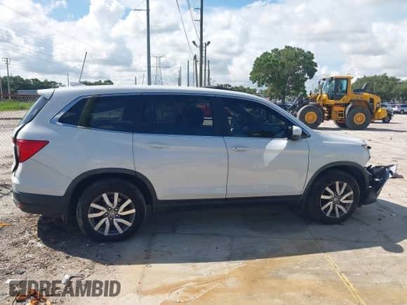 2021 Honda Pilot EX-L z VIN 5FNYF5H59MB017028, wystawiony jako IAAI lot #42580843 z przebiegiem 61 557 mil mil oraz . Historia ofert i sprzedaży dostępna na DreamBid. Obrazek 13.