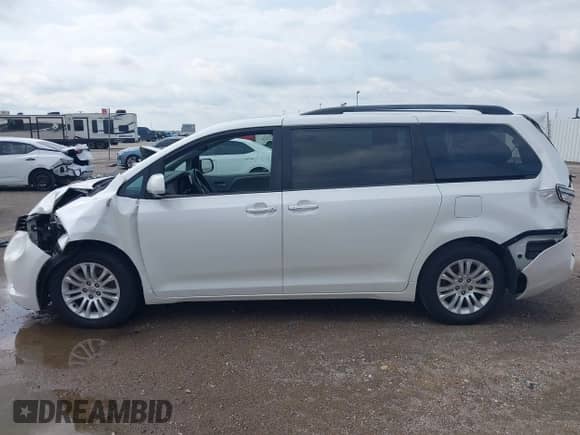 2015 Toyota Sienna XLE with VIN 5TDYK3DC1FS530972, listed as a IAAI auction lot 42896200 with 87,071 mi miles and . Bid and sale history available at DreamBid. Image 14.