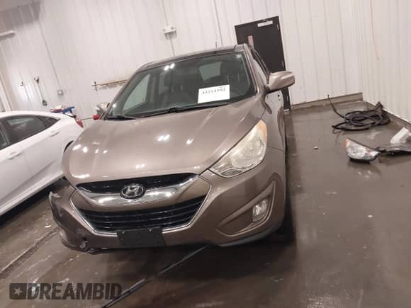 2013 Hyundai Tucson GLS with VIN KM8JU3AC0DU563398, listed as a IAAI auction lot 42214192 with 141,871 mi miles and . Bid and sale history available at DreamBid. Image 13.